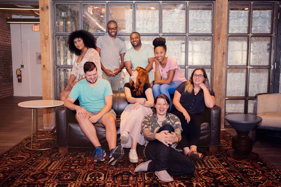 A few Mailchimp employees sitting on a couch