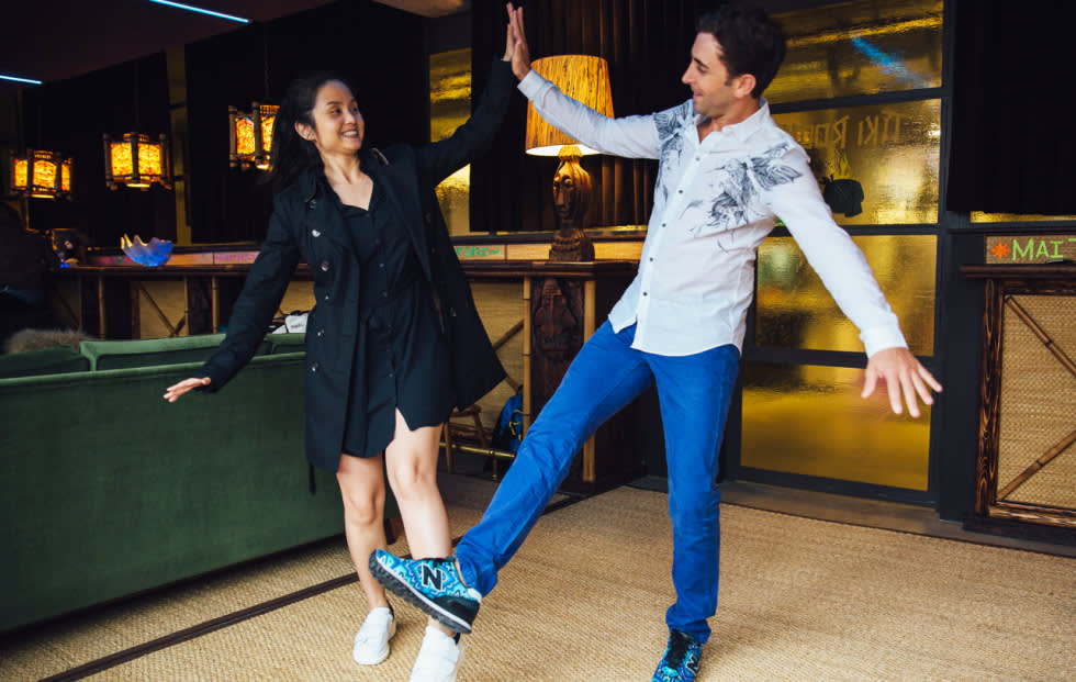 Two people high fiving