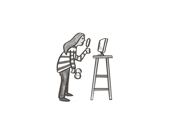 Person looking at screen with magnifying glass