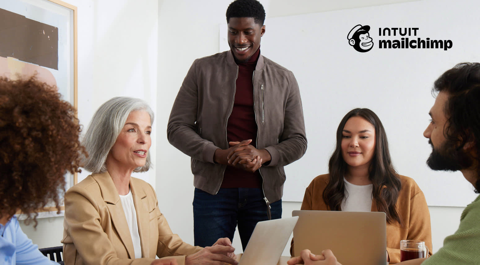 5 team members attending a meeting