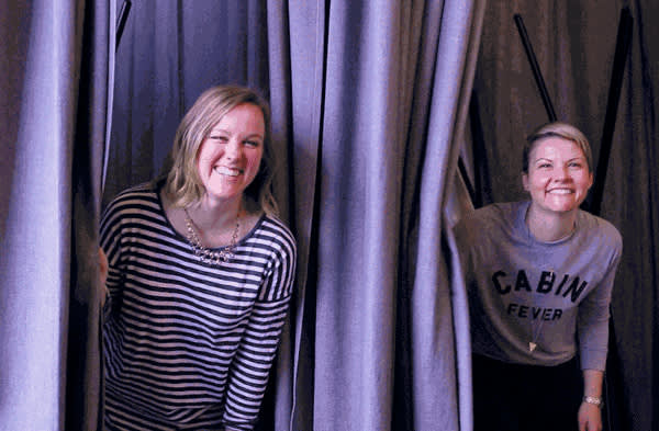 Meg and Melissa peeking out of the changing booths