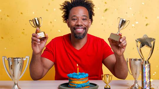 Mailchimp support team member accepting an award