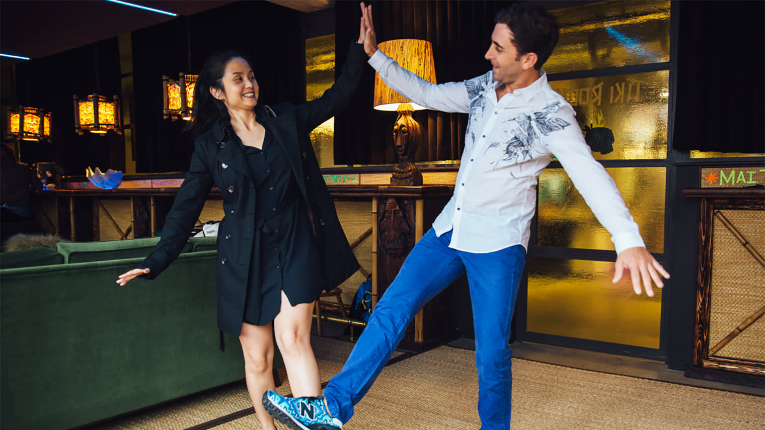 Two people high fiving