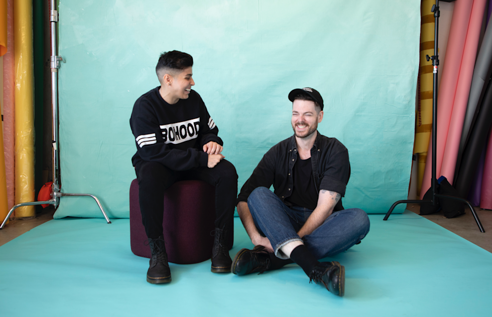 Artist Adam Kurtz sitting with Alyshah Ebrahim, interviewer and QA Analyst at Mailchimp