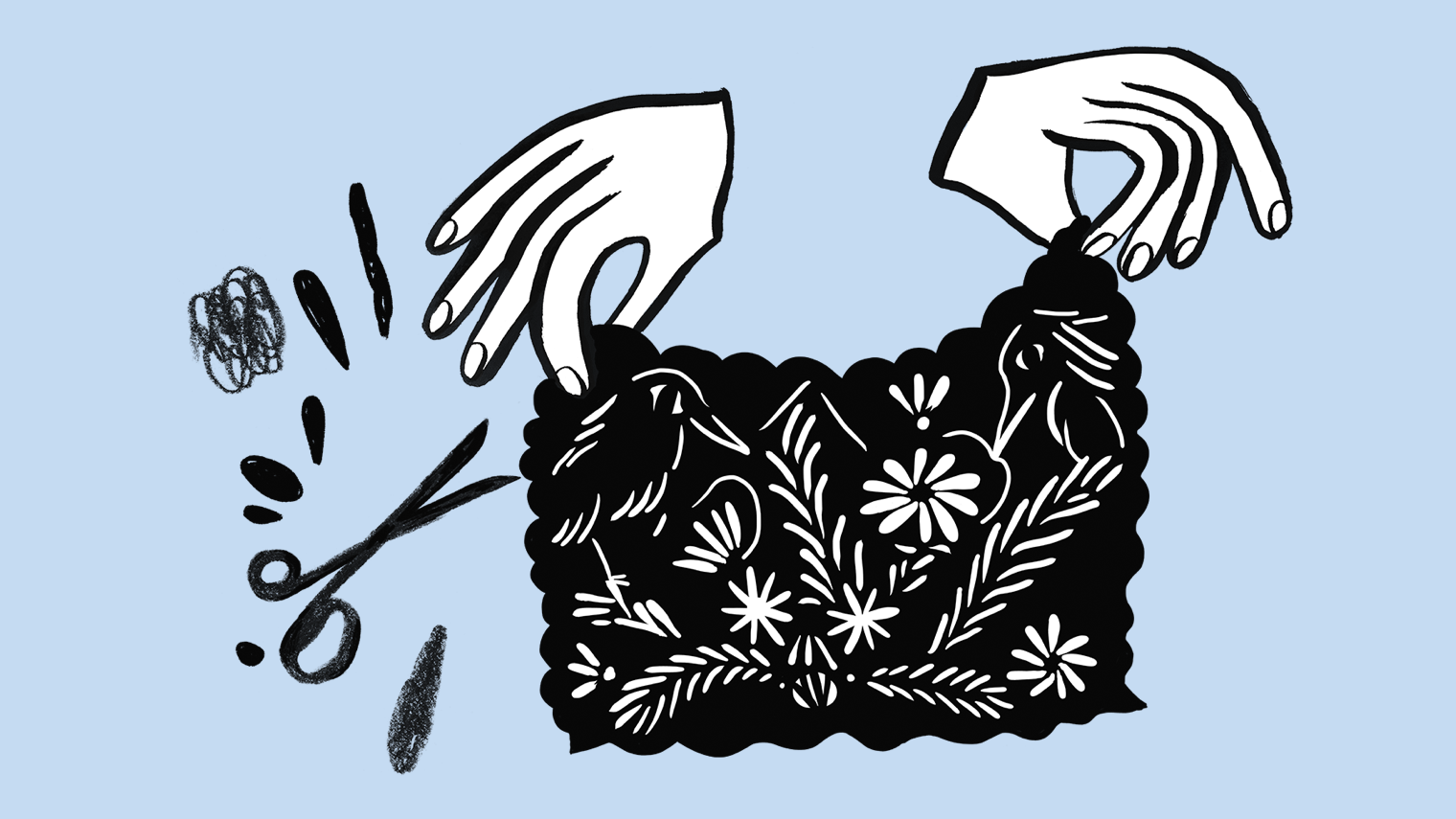 Hands holding up embroidery.