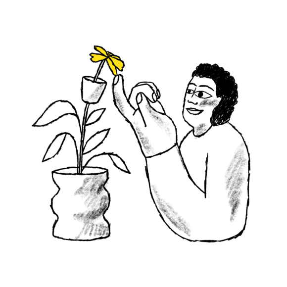 Person pointing to flower