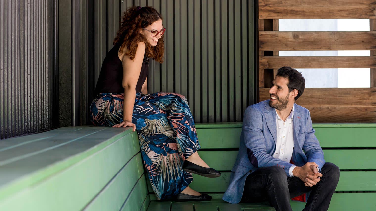 The Agencia Reinicia team smile at each other.