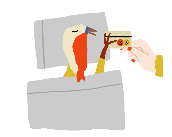 Bird lying in bed reaches for a credit card with happy face stickers 