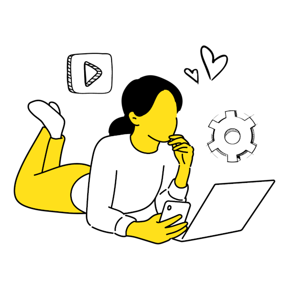 woman on her phone and laptop laying down