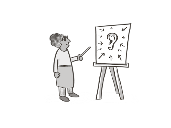 Woman pointing at a image of an ear with arrows