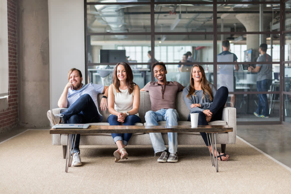A group of Mailchimp employees sitting on a couch