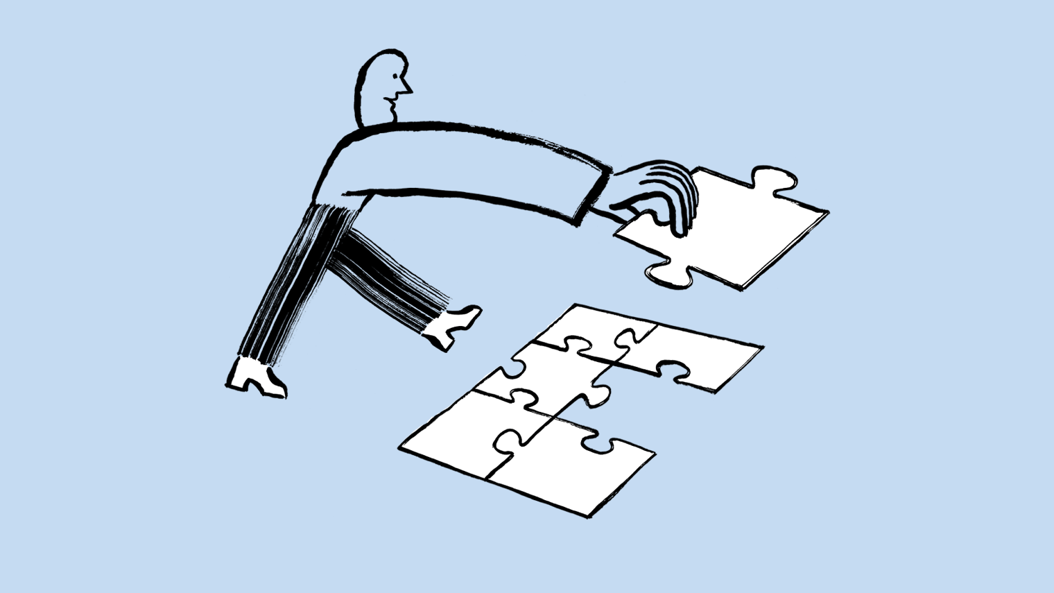 A person putting a puzzle together