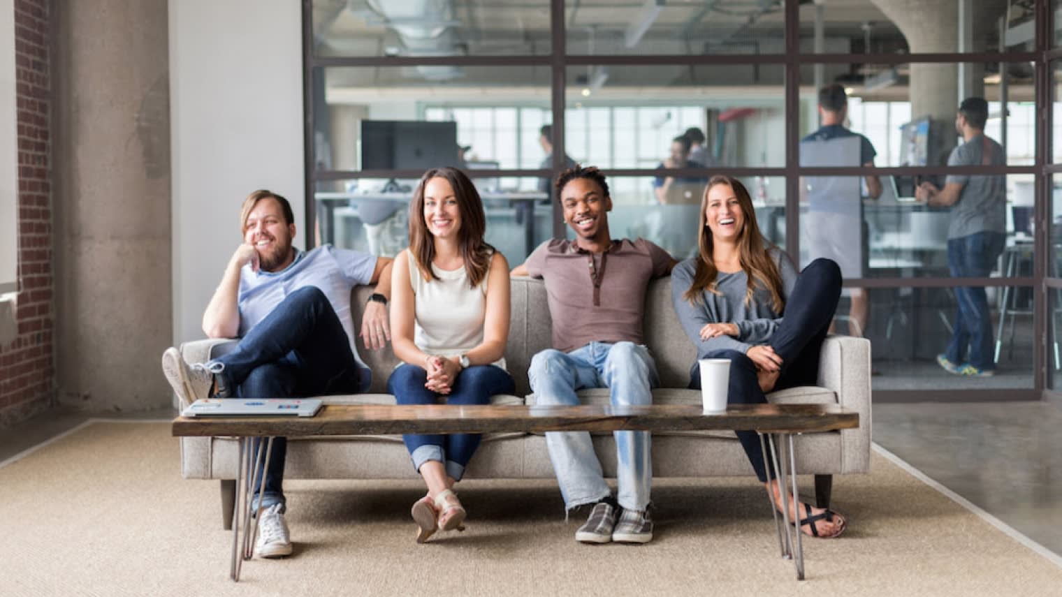 A group of Mailchimp employees sitting on a couch