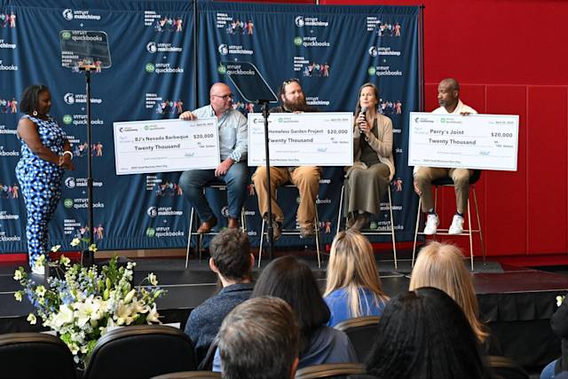 Award ceremony showing three businesses receiving $20,000 checks from Intuit Mailchimp and QuickBooks, with audience watching presentation