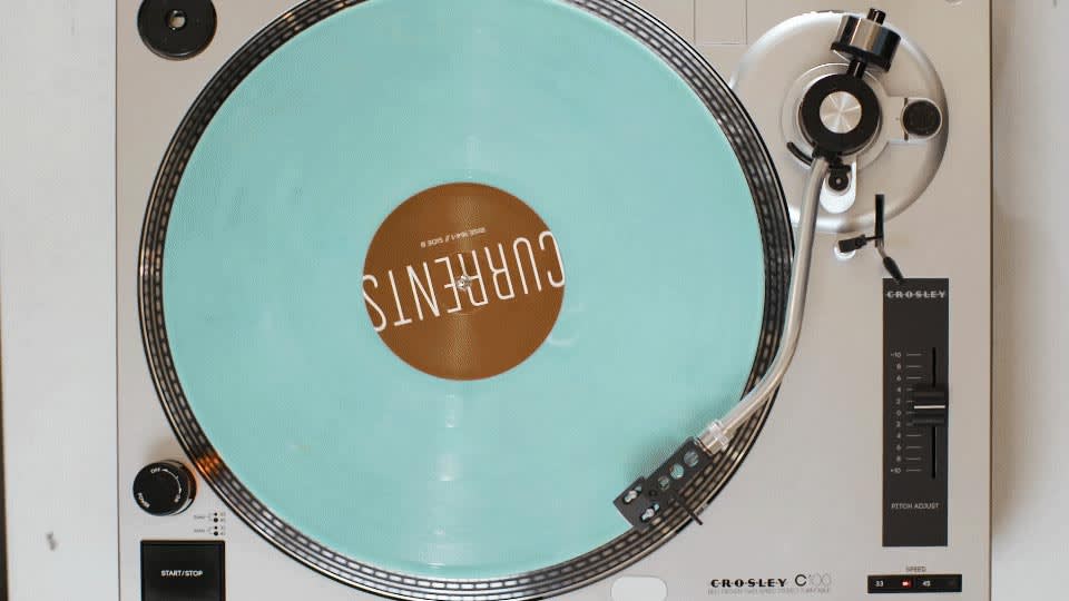 A vinyl record playing on a record player