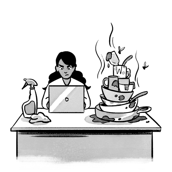 woman working on laptop with a messy desk