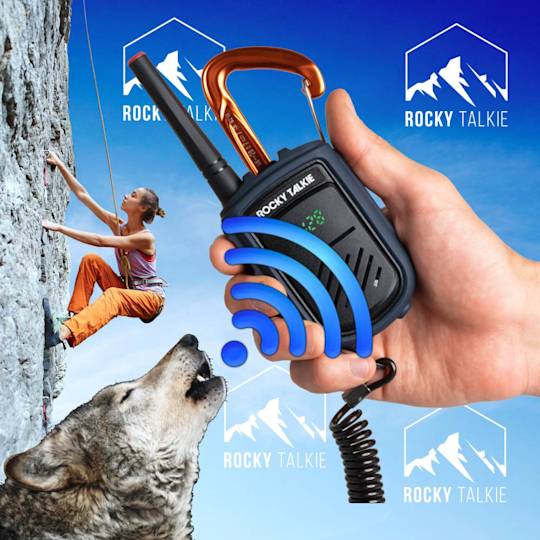 Hand holding Rocky Talkie radio with climbing scene and wolf in background, showing wireless signal and brand logos against blue sky