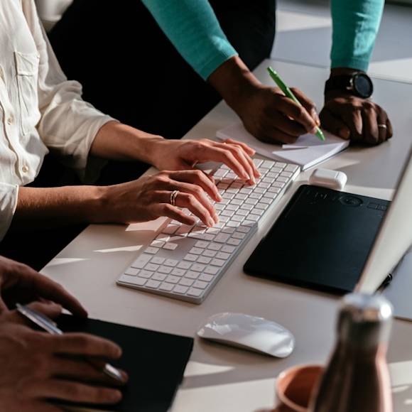 Hands typing on keyboard