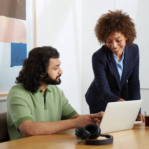 Man and woman looking at a laptop