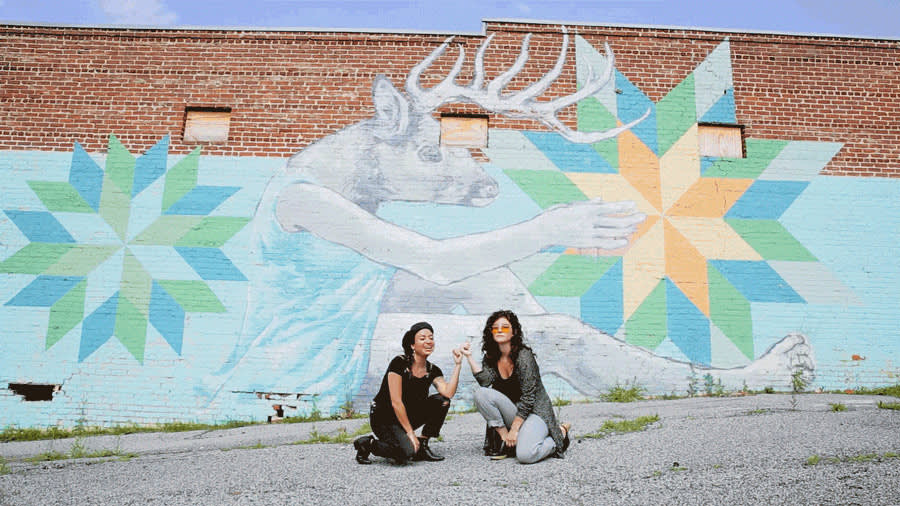 Monica Campana, co-founder of Living Walls, and her trusty sidekick (actual title: executive assistant), Kristen Consuegra