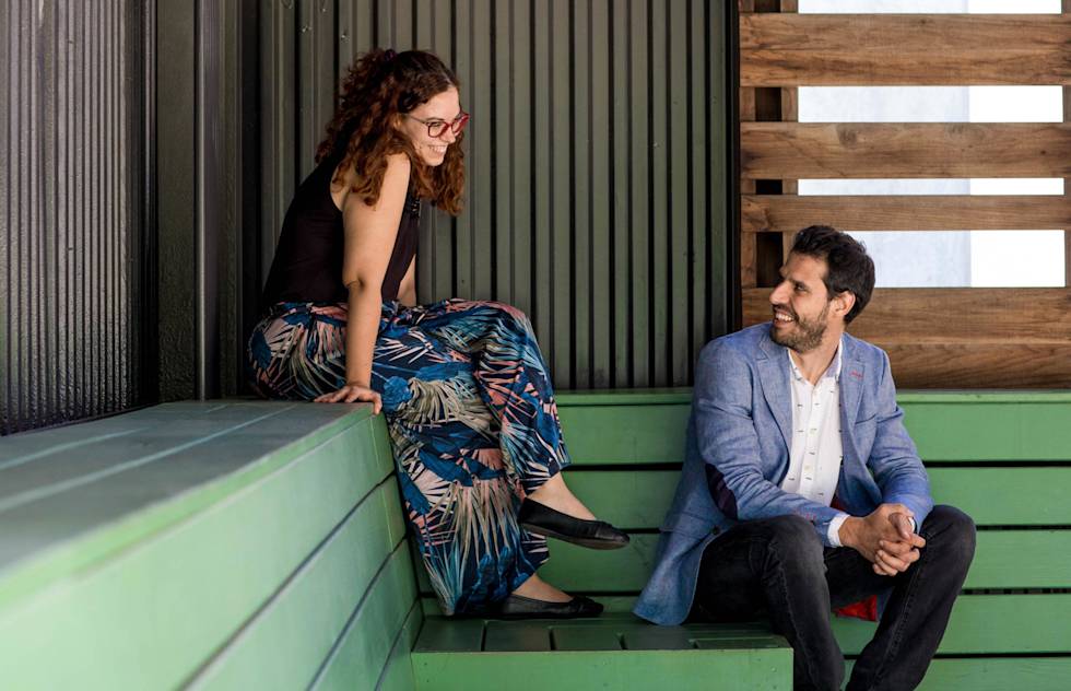 The Agencia Reinicia team smile at each other. 