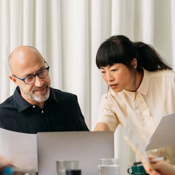 Co-workers collaborating over a document