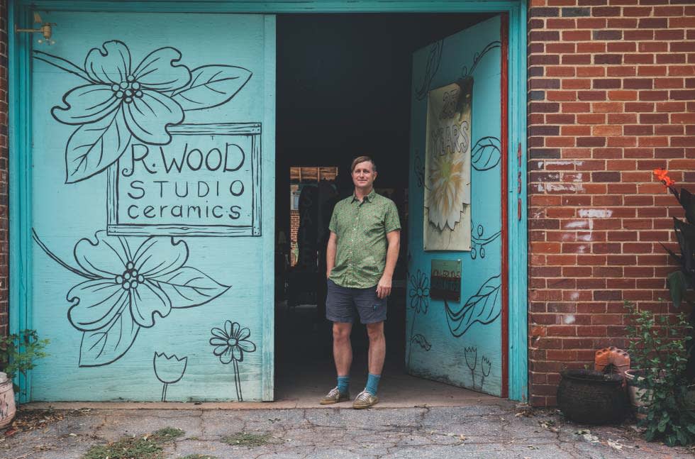 R. Wood Studio Manager Josh Skinner stands outside the studio.
