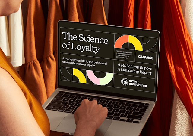 Person on a Laptop viewing The Science of Loyalty Playbook by Mailchimp in partnership with Canvas8