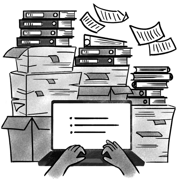 Laptop in front of a stack of documents