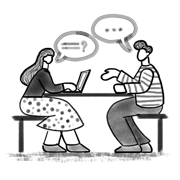 Two people at a table conducting an interview