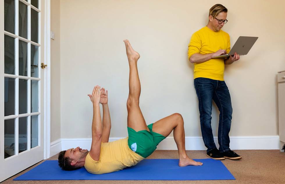 Michael teaching a pilates class from home.
