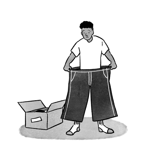 Man trying on very large pants