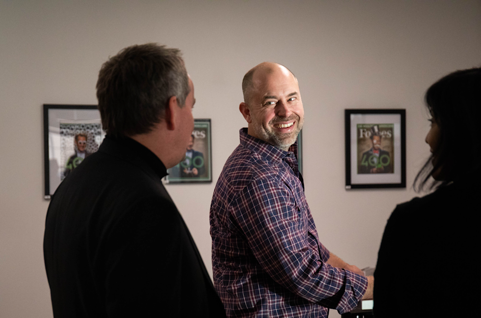 A photograph of Dan smiling while talking to Sean